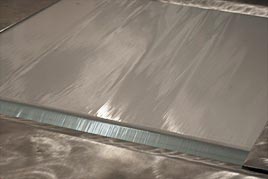 Adhesive foil removes dirt and dust reliably from the soles of people's shoes Adhesive foil removes dirt and dust reliably from the soles of people's shoes