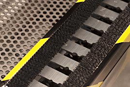 Wheel cleaned by lateral brushes and rotating round brushes from below Wheel cleaned by lateral brushes and rotating round brushes from below
